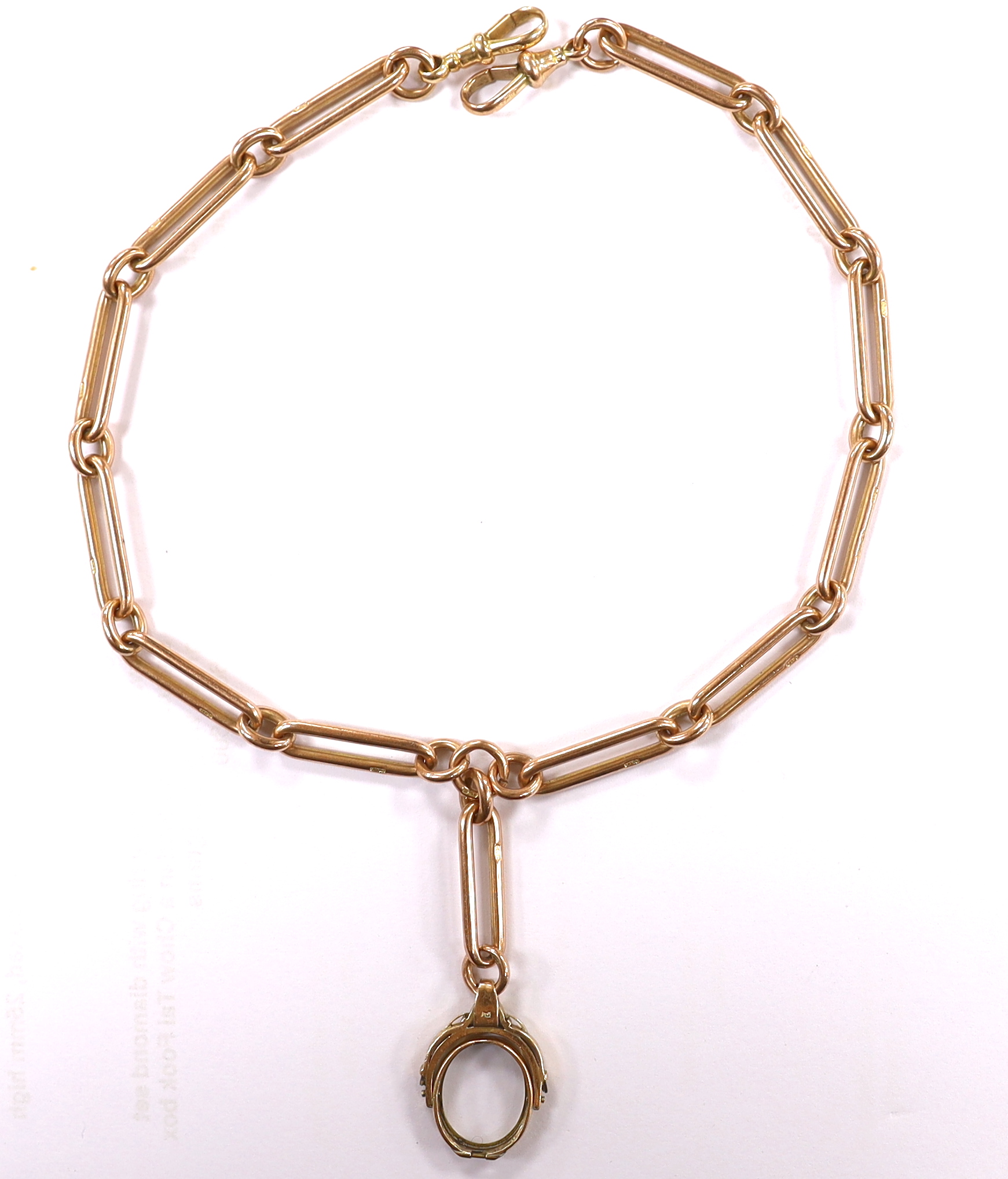 An early 20th century 9ct gold albert, hung with a damaged yellow metal spinning fob, length 43cm